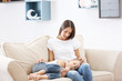 © Africa Studio - Cute girl lying on mothers knees at home