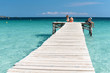 © Wolfgang Jargstorff - XXX - Wooden Jetty at the Mediterranean Sea with young people in the sun - 4116