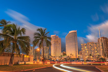 Luxurious Hotels Overlooking The Ala Wai Harbor At Twilight And The Light Trails In Honolulu, Oahu, Hawaii.