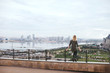 © stock.film - woman sitting on the viewing platform overlooking the city of Kazan