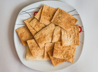 pita chips in white plate