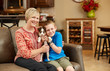 © visiondigital - Happy Mom Son and Puppy at Home