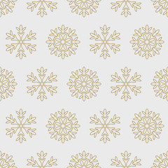 Wall Mural - Gold snowflakes on a gray background pattern seamless