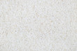 White rice grains evenly layer background horizontal