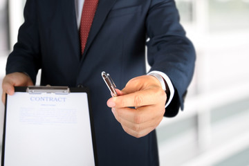 Wall Mural - Business man is offering to sign  a contract, business contract