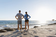 © Sergey Nivens - Young couple on beach training together