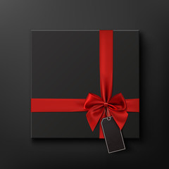 Sticker - Blank, black gift box with red ribbon and price tag.