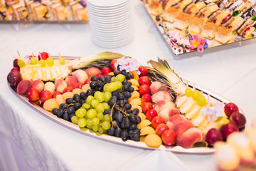 Authentic buffet, assorted fresh fruits, berries and citrus. Preparation for design creative menu