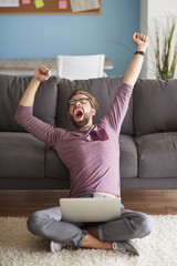 Wall Mural - Yawning man working at home