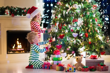 Wall Mural - Kids decorating Christmas tree