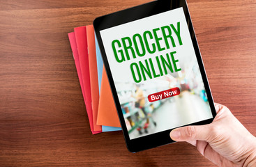 Aufkleber - Top view of hand holding tablet with Grocery online word with ic