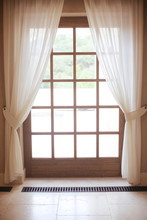 Wooden Window Frame With White Curtain