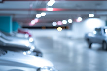 Blurred Image/ Parking Garage - Interior Shot Of Multi-story Car Park, Underground Parking With Cars.