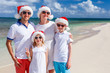 © BlueOrange Studio - Family at beach on Christmas