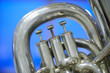 Tuba valves close up against a cool background
