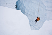 Two Men Practice Crevasse Rescue Skills While On A Ski Mountaineering Course, Ice Fall Lodge, Golden, British Columbia, Canada