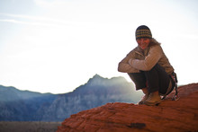 A Female Climber Taking A Break, Red Rocks, Nevada, United States Of America