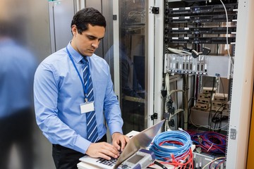 Poster - Technician working on laptop