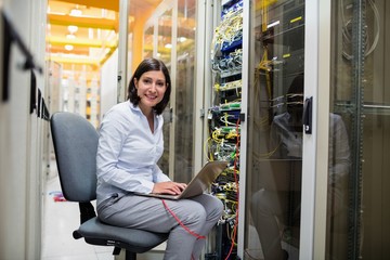 Poster - Technician working on laptop