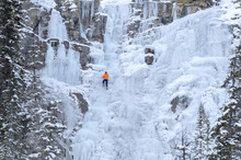 Ice Climber On Frozen Tangle Falls, Jasper National Park, Alberta, Canada