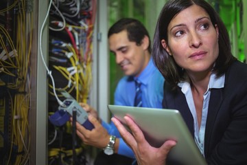 Aufkleber - Technicians analyzing rack mounted server