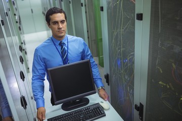 Aufkleber - Technician walking with personal computer in hallway