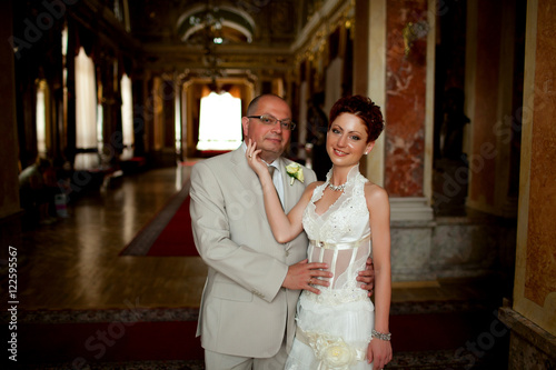 Short Haired Bride Strokes Groom S Chin While They Pose In Old R
