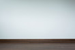© sutichak - empty room interior, brown wood laminate floor and white mortar