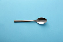 Dessert Spoon On Blue Background