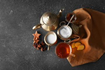 Poster - Ingredients for tea drinking on grey background, flat lay