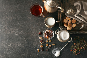 Poster - Ingredients for tea drinking on grey background, flat lay