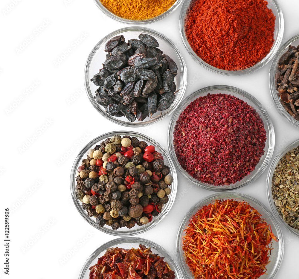 Various spices in glass bowls