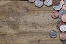 U.S. Coins On Old Wooden Background .