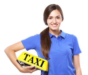 Wall Mural - Beautiful young woman holding taxi car roof sign on white background