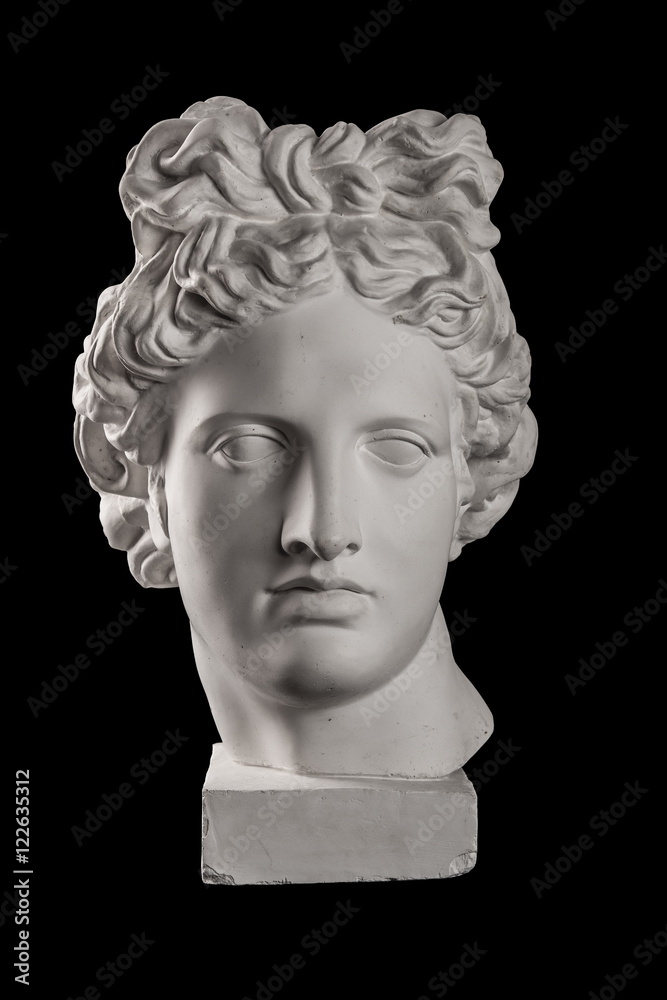 Gypsum statue of Apollo's head on a black background