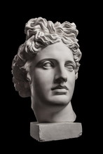 Gypsum Statue Of Apollo's Head On A Black Background