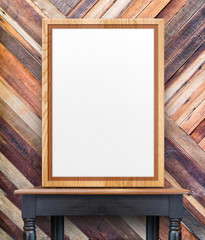 Leinwandbilder - Blank wooden photo frame leaning at diagonal wood wall on vintag