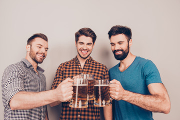 Poster - Cheers ! Three cheerful young men with glasses of beer