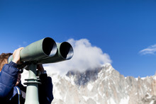 A Boy Looking Through Binoculars On The Mount Blanc 