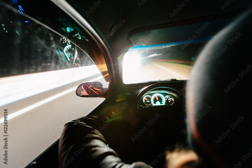 Driving at night. View from inside the car. Photo with a long exposure ...