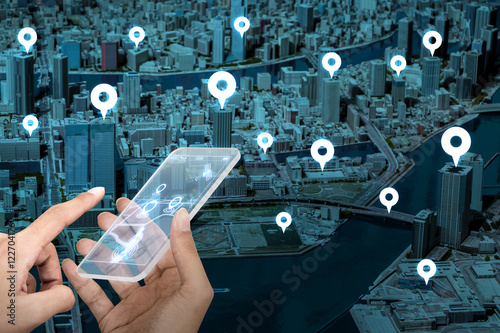 Fotografía futuristic transparent smart phone and location information system, abstract ima