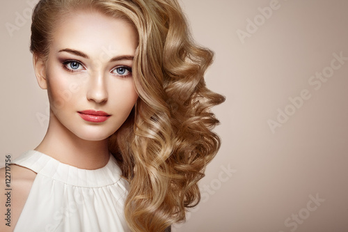 Fotografie, Obraz Fashion portrait of young beautiful woman with jewelry and elegant hairstyle