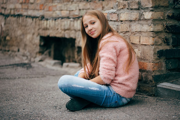 Wall Mural - beautiful young girl posing on the street