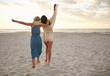 © Jacob Lund - Female friends having fun on the sea shore
