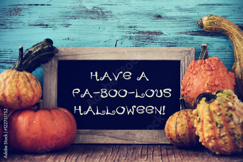 Fotografia, Obraz pumpkins and chalkboard with text have a fa-boo-lous halloween