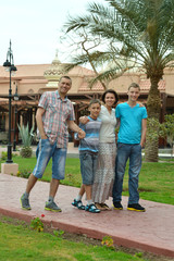 Poster - Family at tropical resort.