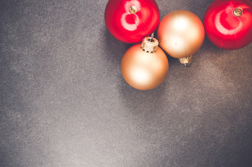 bright colors Christmas decorations on a dark slate surface