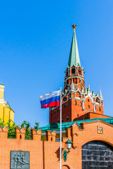 Trinity tower of Moscow Kremlin, Russian flag and the Kremlin bu