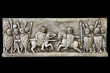 Imitación of a classic medieval frieze showing a knights battle isolated on black background. Clipping path