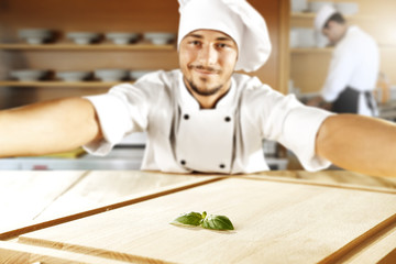 Wall Mural - cook chef making selfie and wooden top place 